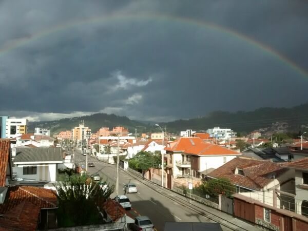 picture of rainbow and green hills in Cuenca Ecuador - How to Travel & Invest In Real Estate – 10 Essential Tools of the Trade