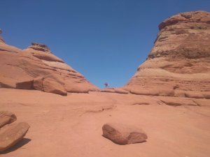 Financial Independence Using Real Estate Crowdfunding Loans - Kiddo Doing Yoga Pose at Arches National Park