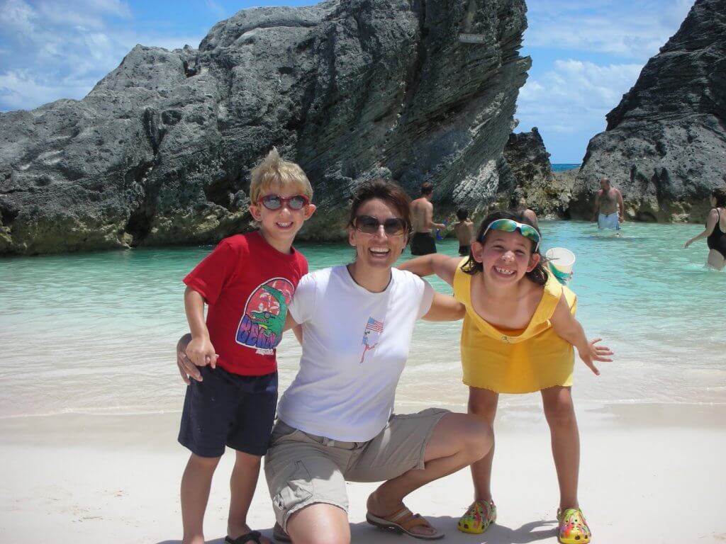 Kat at beach with kids - How a Busy Mom Found Financial Freedom Through Real Estate Investing