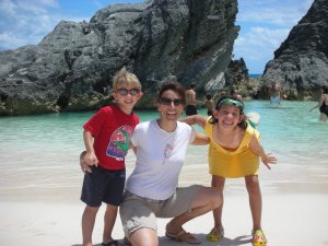 Kat at beach with kids - How This Busy Mom Found Financial Freedom Through Real Estate Investing